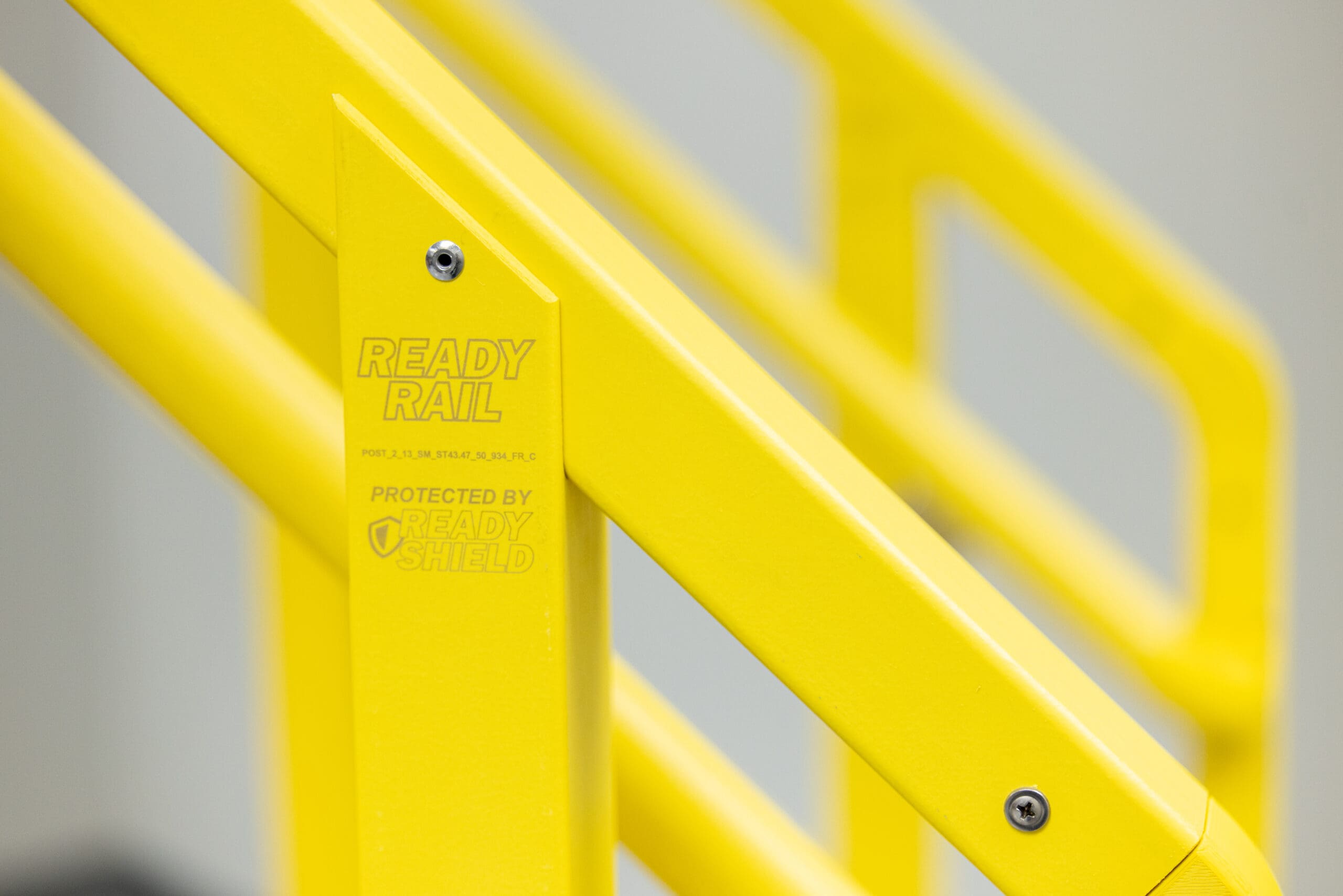 Close-up of yellow ReadyRail with Protected by ReadyShield label