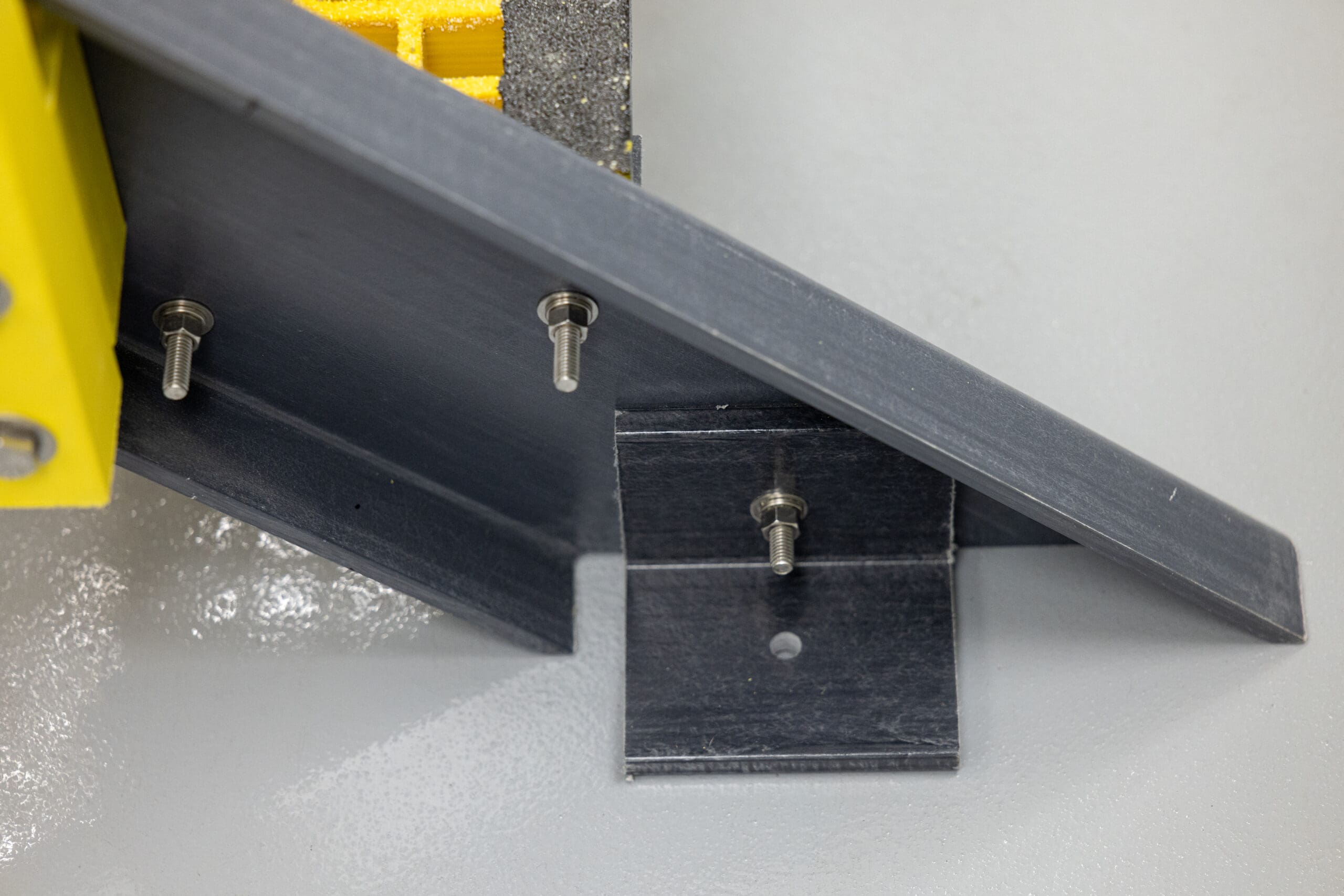 Close-up of yellow ReadyStairs support and connection points