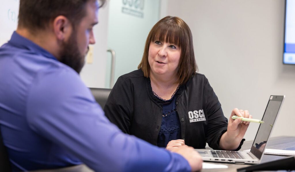 OSCO Safety employee going over order with customer.