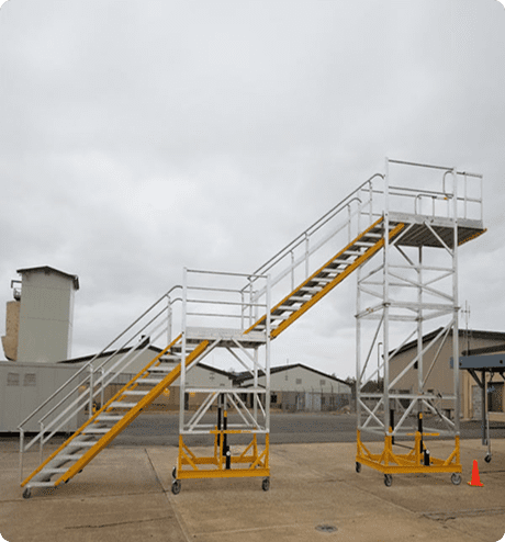 Two-tiered rolling stairs on a concrete lot