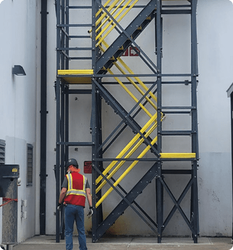 Employee standing in front of modular stair tower